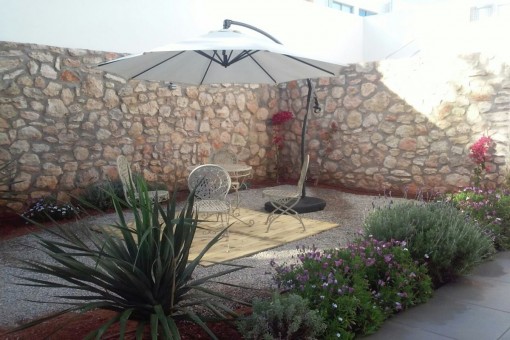 Terrace with natural stone wall