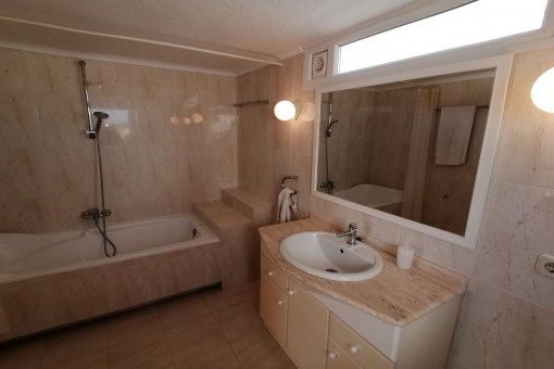 Master bathroom with bath tub